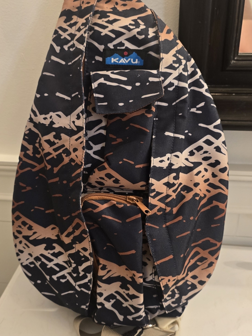 KAVU Rope Sling Bag in Navy & Tan Abstract Print